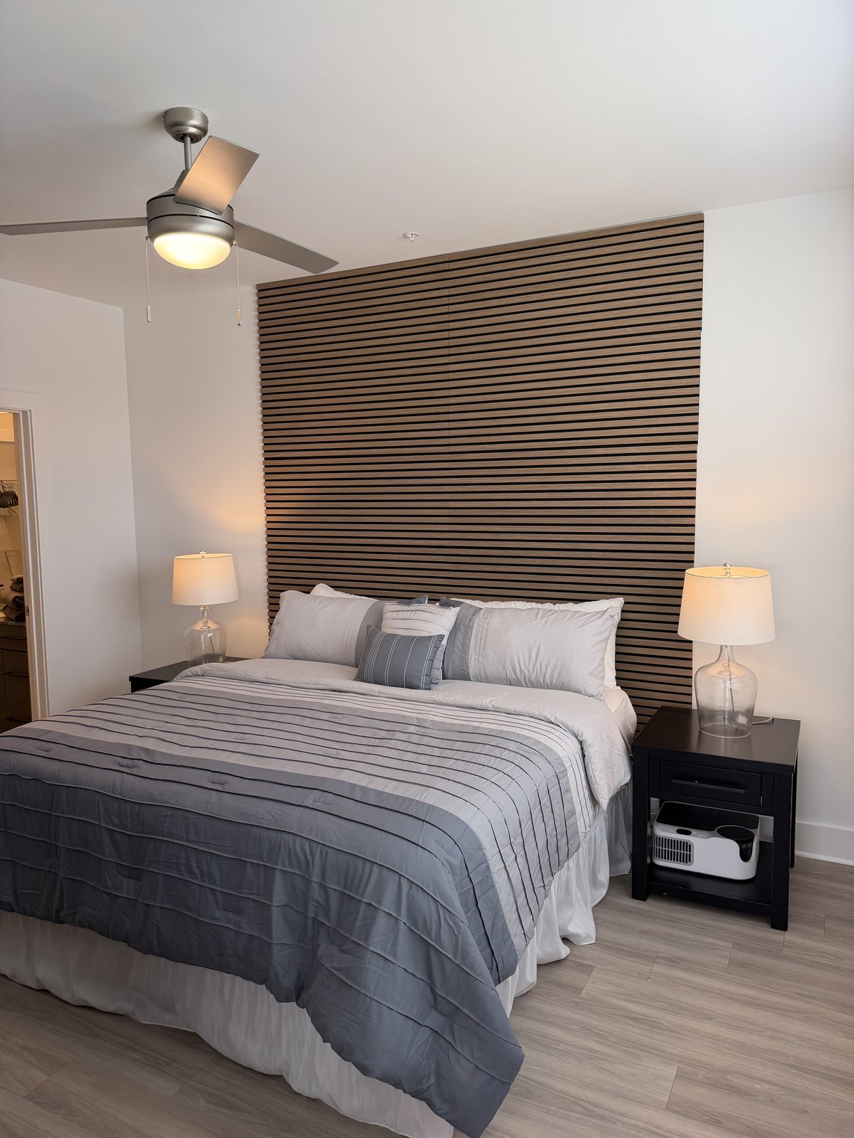 King bed with slatted wood accent wall