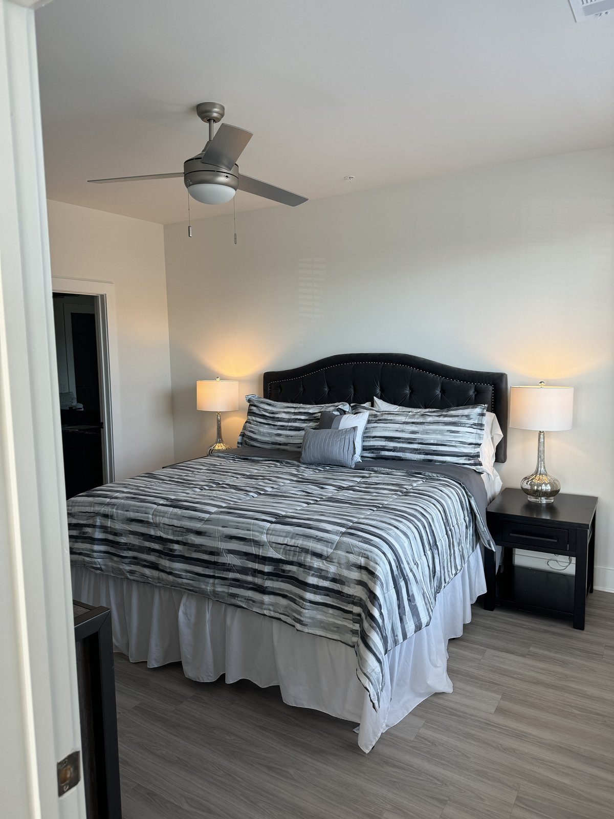 Bedroom with tufted velvet headboard